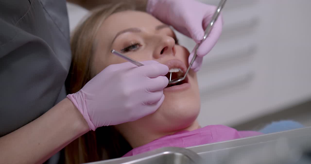 Dentist treating a patient at Aura Smile Dental Clinic